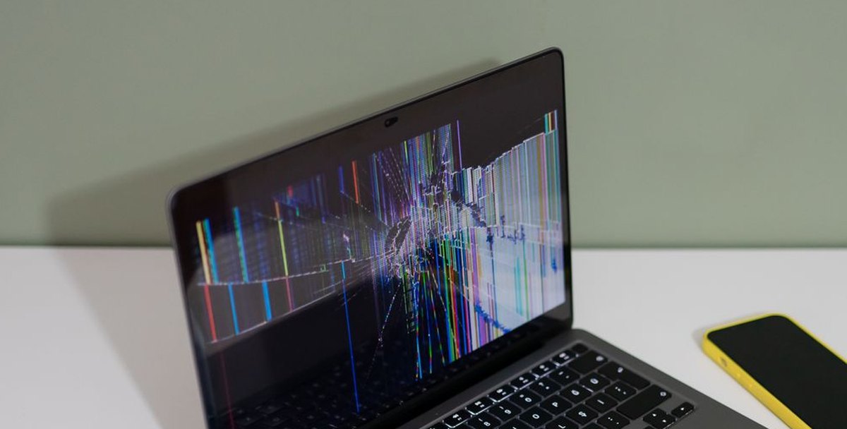 Laptop with a damaged display before repair