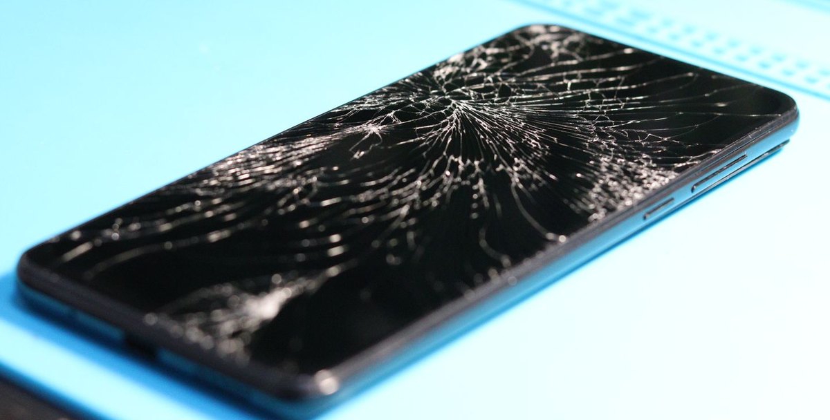 Phone with a badly cracked screen before repair